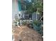 Exterior view of home showing mechanical equipment and general disrepair at 1831 Pasadena Dr, Dunedin, FL 34698