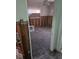 Bedroom showing missing drywall and damaged floor at 1831 Pasadena Dr, Dunedin, FL 34698