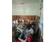 Interior room showing missing drywall and personal possessions at 1831 Pasadena Dr, Dunedin, FL 34698