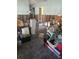 Interior living room showing significant drywall damage and personal items at 1831 Pasadena Dr, Dunedin, FL 34698