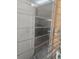 Louvered glass window looking into interior of a home at 1831 Pasadena Dr, Dunedin, FL 34698