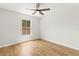 Bedroom with wood floors, a ceiling fan and natural light at 2032 Sunset Meadow Dr, Clearwater, FL 33763