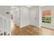 Entryway featuring wood floors and white doors at 2032 Sunset Meadow Dr, Clearwater, FL 33763