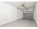 Garage with automatic overhead door and painted floor at 2032 Sunset Meadow Dr, Clearwater, FL 33763