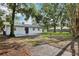 Large backyard featuring rear exterior and tree coverage at 2220 3Rd E Ave, Bradenton, FL 34208