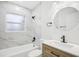 Updated bathroom with marble tile, new vanity, and modern fixtures at 2220 3Rd E Ave, Bradenton, FL 34208