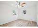 Bright bedroom with wood-look floors and dual windows at 2220 3Rd E Ave, Bradenton, FL 34208