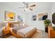 Cozy bedroom with ample natural light, neutral colors, and comfortable furnishings at 2220 3Rd E Ave, Bradenton, FL 34208