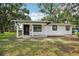 Charming one-story home featuring a freshly painted exterior and a welcoming front porch at 2220 3Rd E Ave, Bradenton, FL 34208