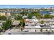 Aerial view of townhomes near water, showcasing neighborhood, landscaping, and nearby harbor at 230 Columbia Dr, Tampa, FL 33606