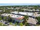 Aerial view of neighborhood townhomes featuring nearby buildings, landscaping, and street access at 230 Columbia Dr, Tampa, FL 33606