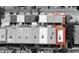 Aerial view of neighborhood townhomes featuring street, landscaping, and nearby commercial buildings at 230 Columbia Dr, Tampa, FL 33606