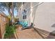 Cozy backyard patio area with seating and beautiful foliage, perfect for outdoor relaxation and entertaining at 230 Columbia Dr, Tampa, FL 33606