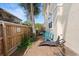 Cozy backyard patio area with seating and beautiful foliage, perfect for outdoor relaxation and entertaining at 230 Columbia Dr, Tampa, FL 33606