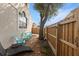 Cozy backyard patio area with seating and beautiful foliage, perfect for outdoor relaxation and entertaining at 230 Columbia Dr, Tampa, FL 33606