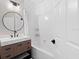 Stylish bathroom featuring modern fixtures, a tub and shower combination, and great lighting at 230 Columbia Dr, Tampa, FL 33606
