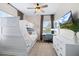 Well-designed bedroom featuring modern bunkbeds, a built in desk, and hardwood flooring at 230 Columbia Dr, Tampa, FL 33606
