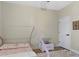 Charming bedroom with hardwood floors, decorative bed and white storage box at 230 Columbia Dr, Tampa, FL 33606