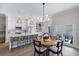 Bright kitchen with island seating, modern lighting, and stainless appliances at 230 Columbia Dr, Tampa, FL 33606