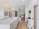 Modern kitchen featuring a spacious island with white countertops and stainless steel appliances at 230 Columbia Dr, Tampa, FL 33606