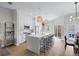Modern kitchen with an island, pendant lights, and stainless steel appliances at 230 Columbia Dr, Tampa, FL 33606