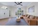 Bright living room with a large sectional sofa and modern decor at 230 Columbia Dr, Tampa, FL 33606