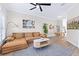 Open living area with cozy seating and an adjacent dining space at 230 Columbia Dr, Tampa, FL 33606