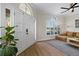 Living room showcasing the front door, large window and modern interior at 230 Columbia Dr, Tampa, FL 33606