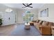 Comfortable living room featuring a plush sofa and view of front entrance at 230 Columbia Dr, Tampa, FL 33606