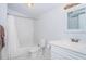 Bathroom with subway tiled shower and tub and white vanity with modern fixtures at 2320 E 12Th Ave, Tampa, FL 33605