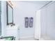 Bright bathroom with white subway tile shower and modern vanity with a beautiful mirror at 2320 E 12Th Ave, Tampa, FL 33605