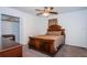 Comfortable bedroom featuring carpet flooring, a ceiling fan, and a spacious closet at 2320 E 12Th Ave, Tampa, FL 33605