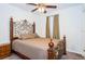Elegant bedroom with decorative headboard, carpet flooring, and ample natural light at 2320 E 12Th Ave, Tampa, FL 33605