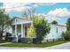 View of a charming single-story home with a covered front porch and cottage-style design at 2320 E 12Th Ave, Tampa, FL 33605