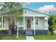 Charming single-story home featuring a covered front porch and well-maintained landscaping at 2320 E 12Th Ave, Tampa, FL 33605