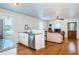 Bright kitchen seamlessly flows into the living room, featuring granite countertops and modern appliances at 2320 E 12Th Ave, Tampa, FL 33605