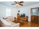 Inviting living room with hardwood floors, natural light, and a ceiling fan at 2320 E 12Th Ave, Tampa, FL 33605