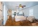 Bright, open-concept living space with hardwood floors and an adjacent kitchen at 2320 E 12Th Ave, Tampa, FL 33605