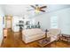 Open-concept living room with hardwood floors seamlessly connected to the kitchen at 2320 E 12Th Ave, Tampa, FL 33605