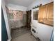 Bathroom remodel showing damaged walls and exposed fixtures at 2402 E 148Th Ave, Lutz, FL 33549