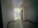 Small bedroom with tile floors and built-in shelves at 2402 E 148Th Ave, Lutz, FL 33549