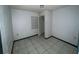 Small bedroom with tile floors and a closet at 2402 E 148Th Ave, Lutz, FL 33549