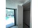 Inside of closet with a view of the pool outside the sliding glass doors at 2402 E 148Th Ave, Lutz, FL 33549