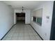 Dining room features tiled floor, windows, and chandelier at 2402 E 148Th Ave, Lutz, FL 33549