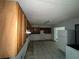 Spacious kitchen featuring tile flooring and ample cabinetry space at 2402 E 148Th Ave, Lutz, FL 33549