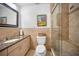 Modern bathroom with granite countertops and a glass-enclosed shower at 250 Rosery Nw Rd # 218, Largo, FL 33770