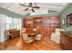 Charming dining room with hardwood floors, a ceiling fan, and abundant natural light at 250 Rosery Nw Rd # 218, Largo, FL 33770