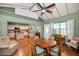 Inviting dining area featuring hardwood floors, a ceiling fan, and a view of the kitchen at 250 Rosery Nw Rd # 218, Largo, FL 33770
