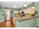 Modern kitchen with stainless steel appliances, granite countertops, and an island at 250 Rosery Nw Rd # 218, Largo, FL 33770