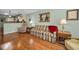 Inviting living room featuring hardwood floors and a comfortable sofa with a red throw at 250 Rosery Nw Rd # 218, Largo, FL 33770